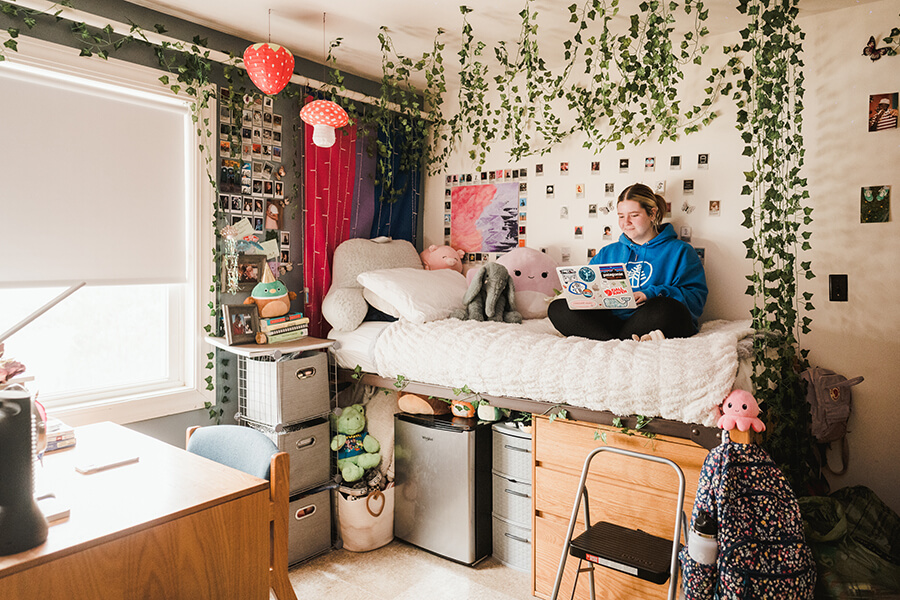 Residential Living 6 A female student studies in her dorm room.
