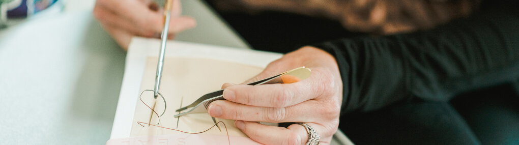 banner image of FNP student practicing suturing skills