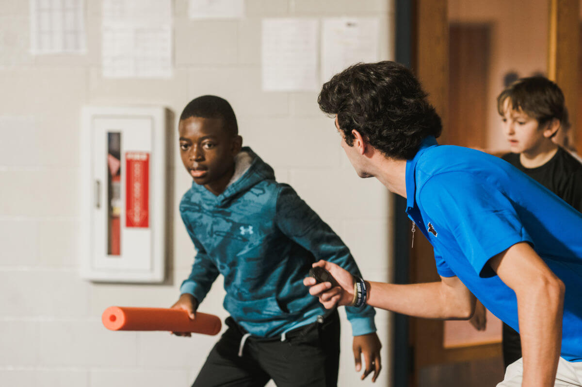 Sport and exercise science student works with area fifth graders on fitness.