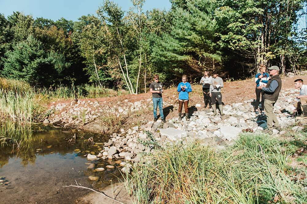 Community Leadership 2 Science students doing field studies in a watershed area