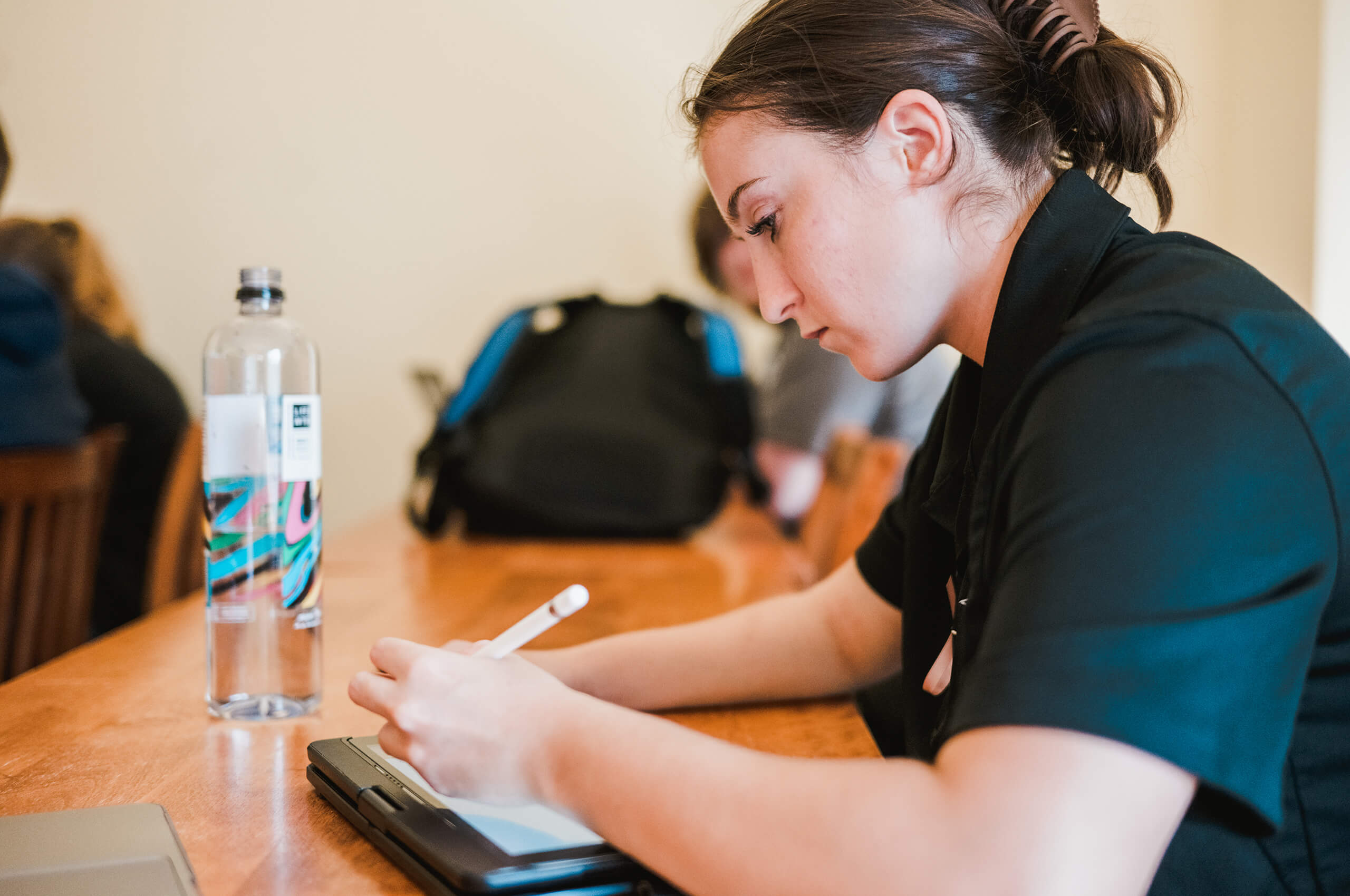 Student in classroom at Saint Joseph's College of Maine
