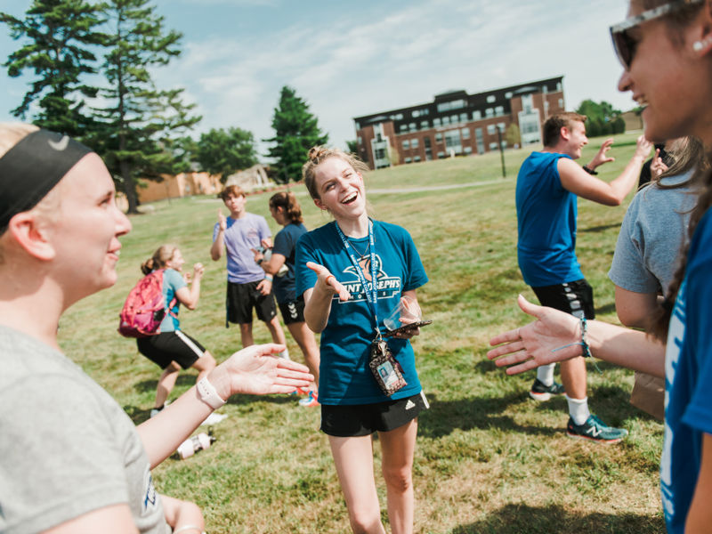 Students greet each other at new student orientation