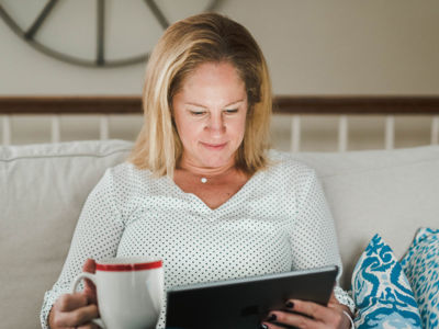 Woman reading from a tablet