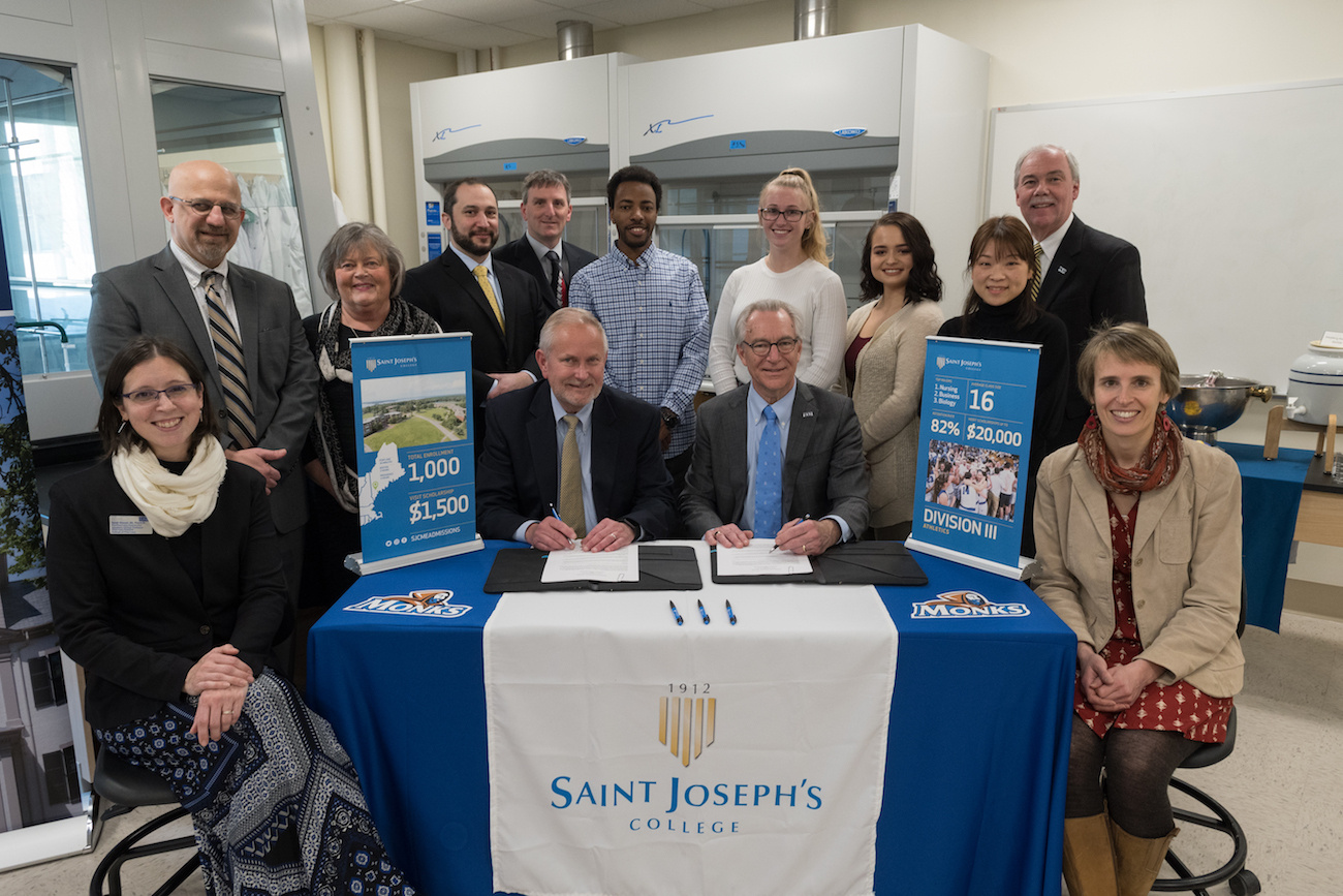 Saint Joseph's College and UNE personnel gather at signing of Pre-Pharmacy Agreement