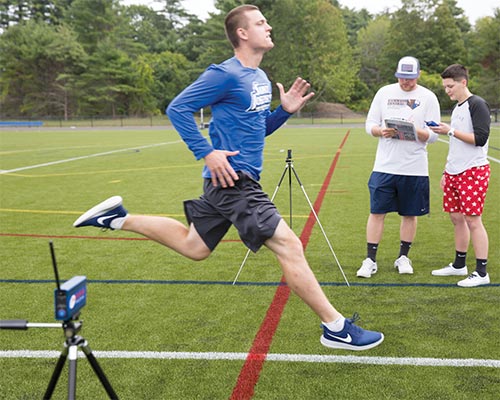 exercise science students in the field tracking running rate