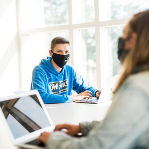 students wear face coverings in class during pandemic