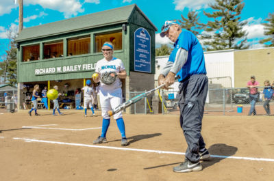 Dick Bailey works with athletes during athletes