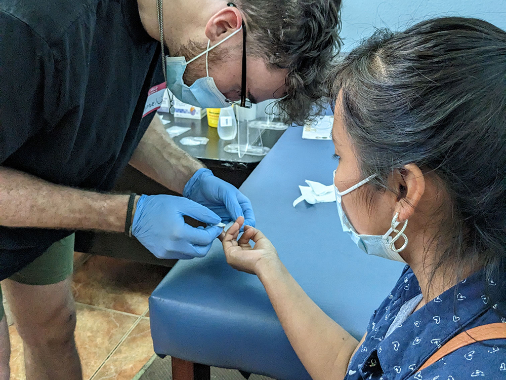 Guatemala service trip Dec 2022, students working in the medical clinic.