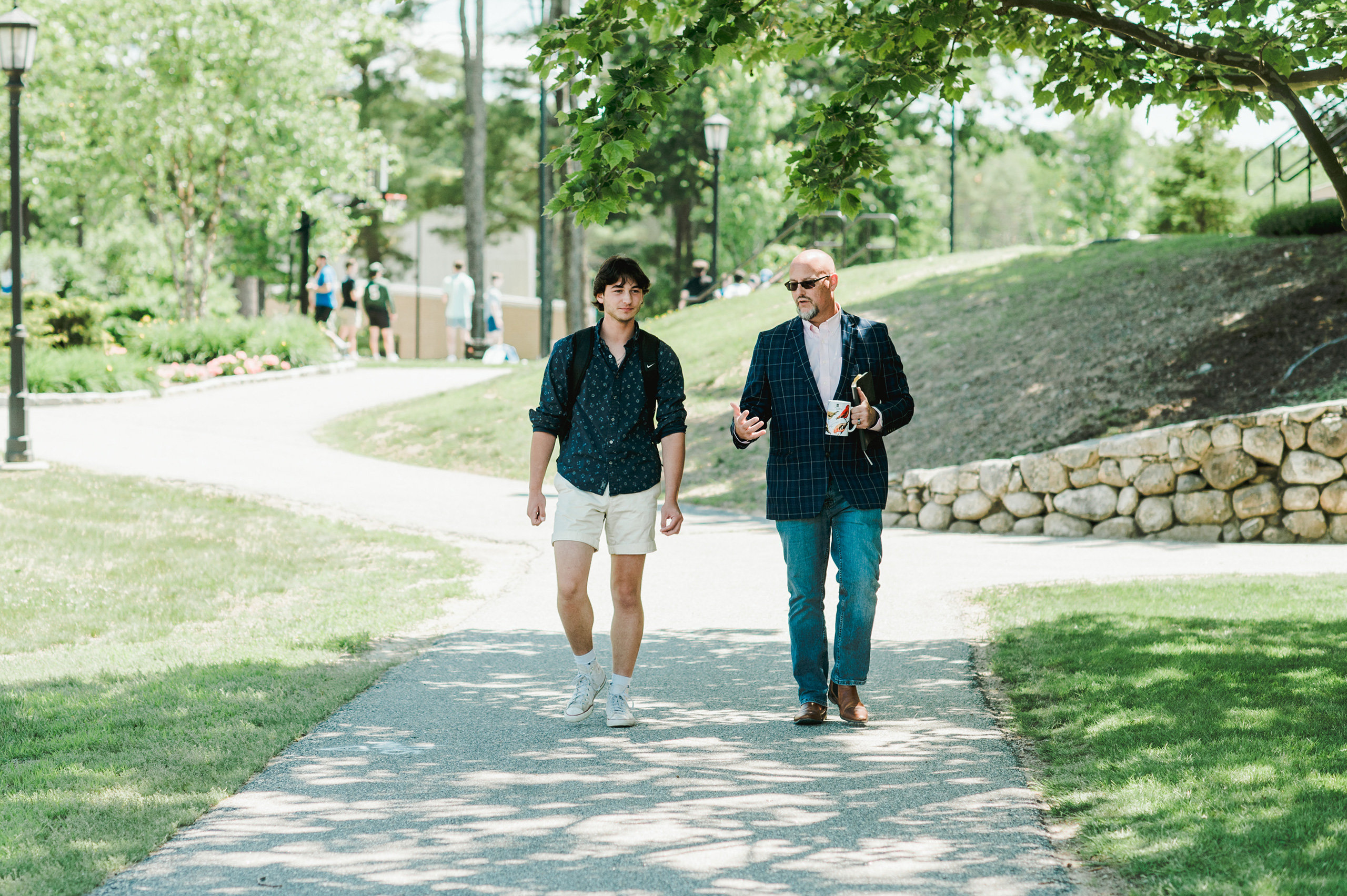 A student talks with Leadership for Sustainable Communities professor