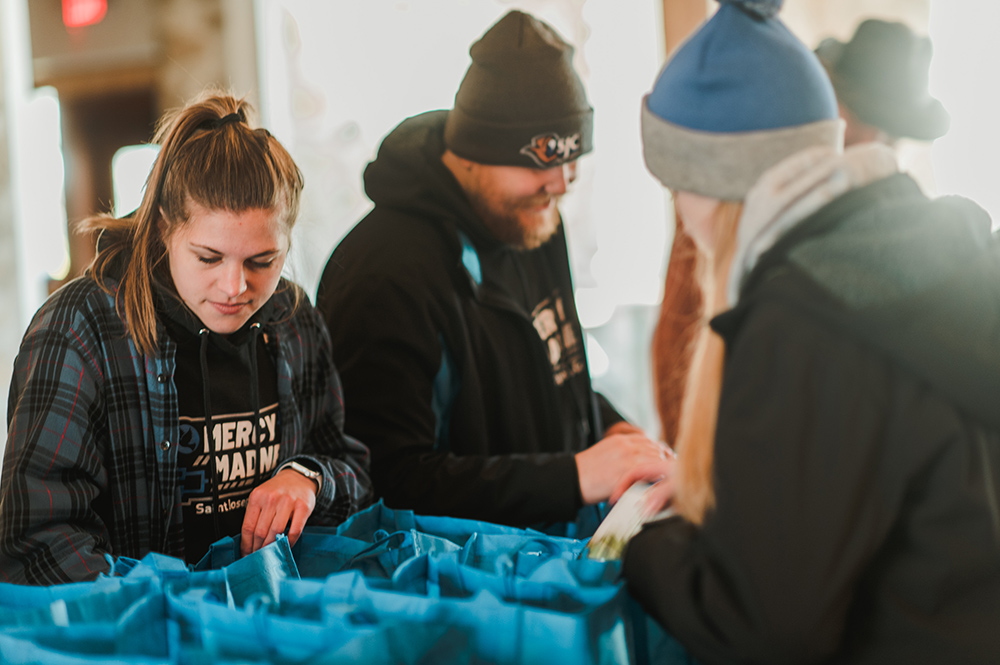 Students packing food packages for area food pantry