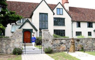 Margaret stands in front of Xavier Hall.