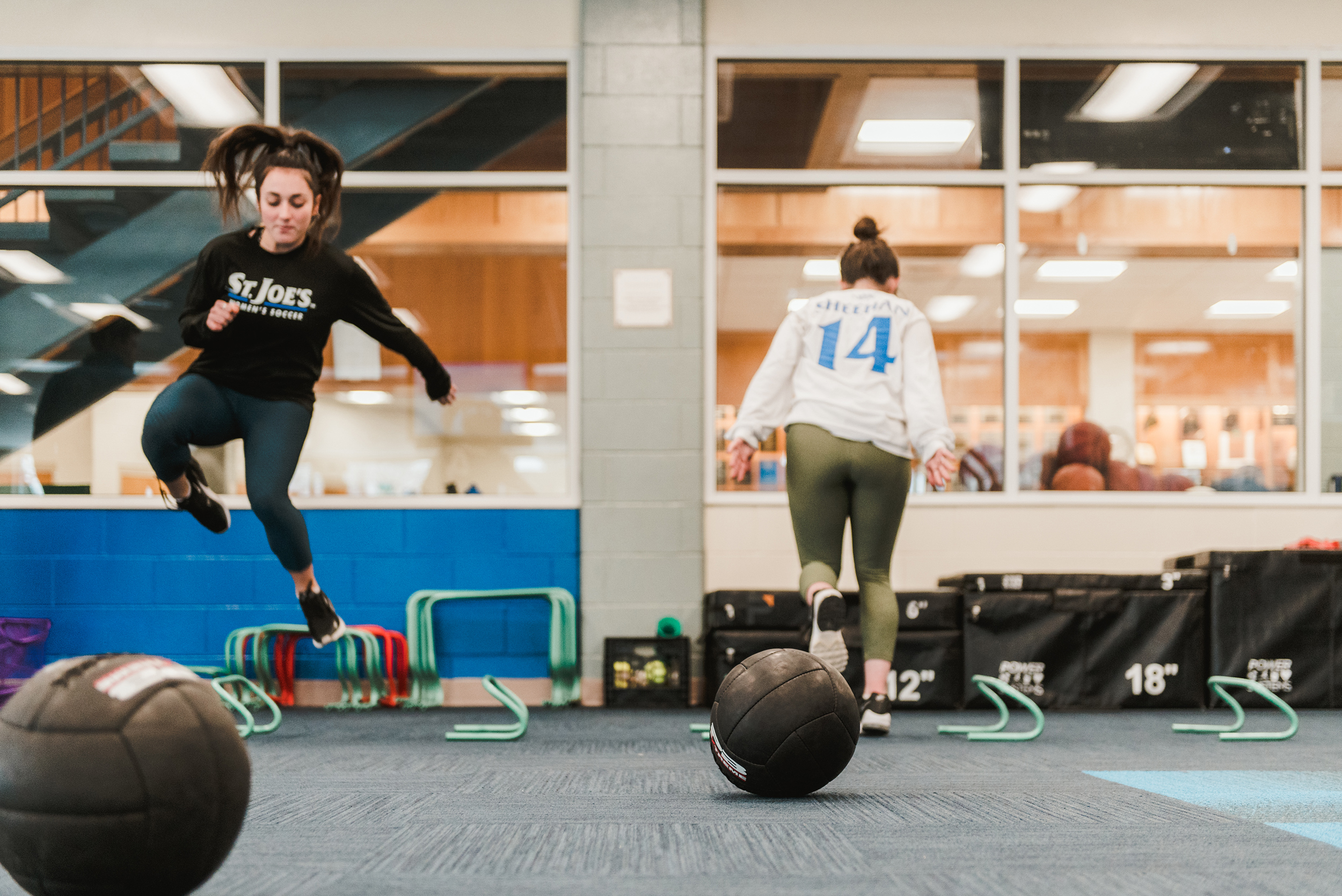 Students working out in Alfond Center weight room