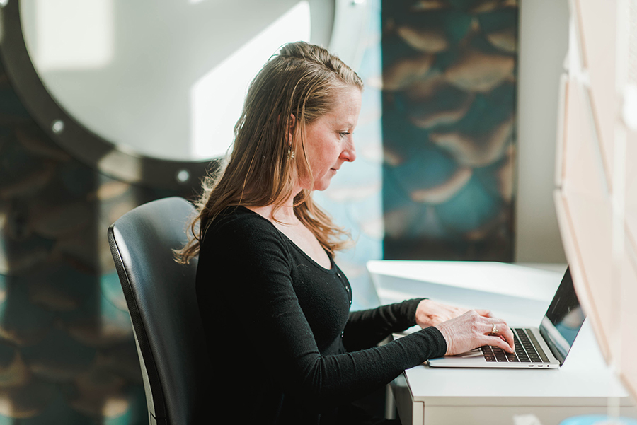 Online learner on her laptop