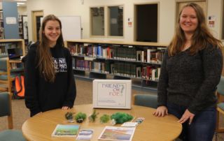 The student pose with their teaching materials