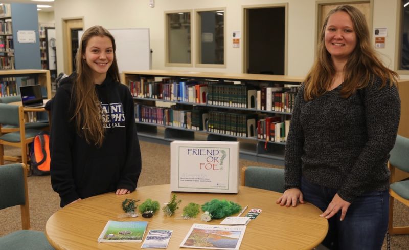 The student pose with their teaching materials