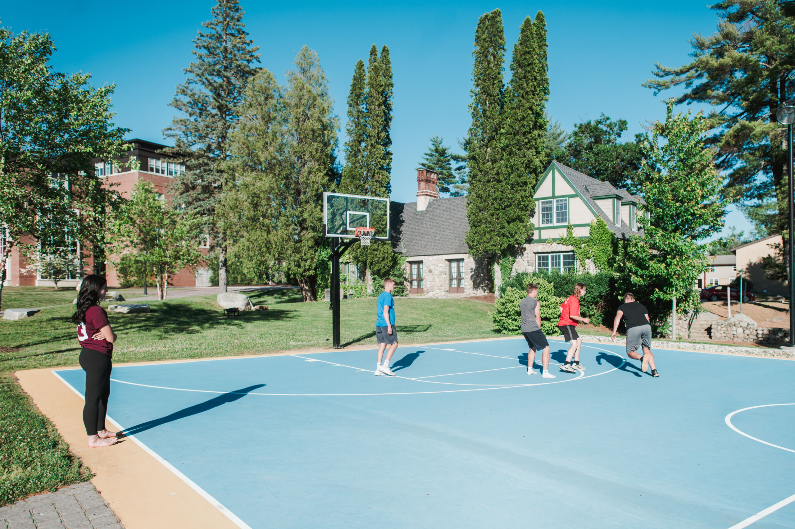 students play basketball