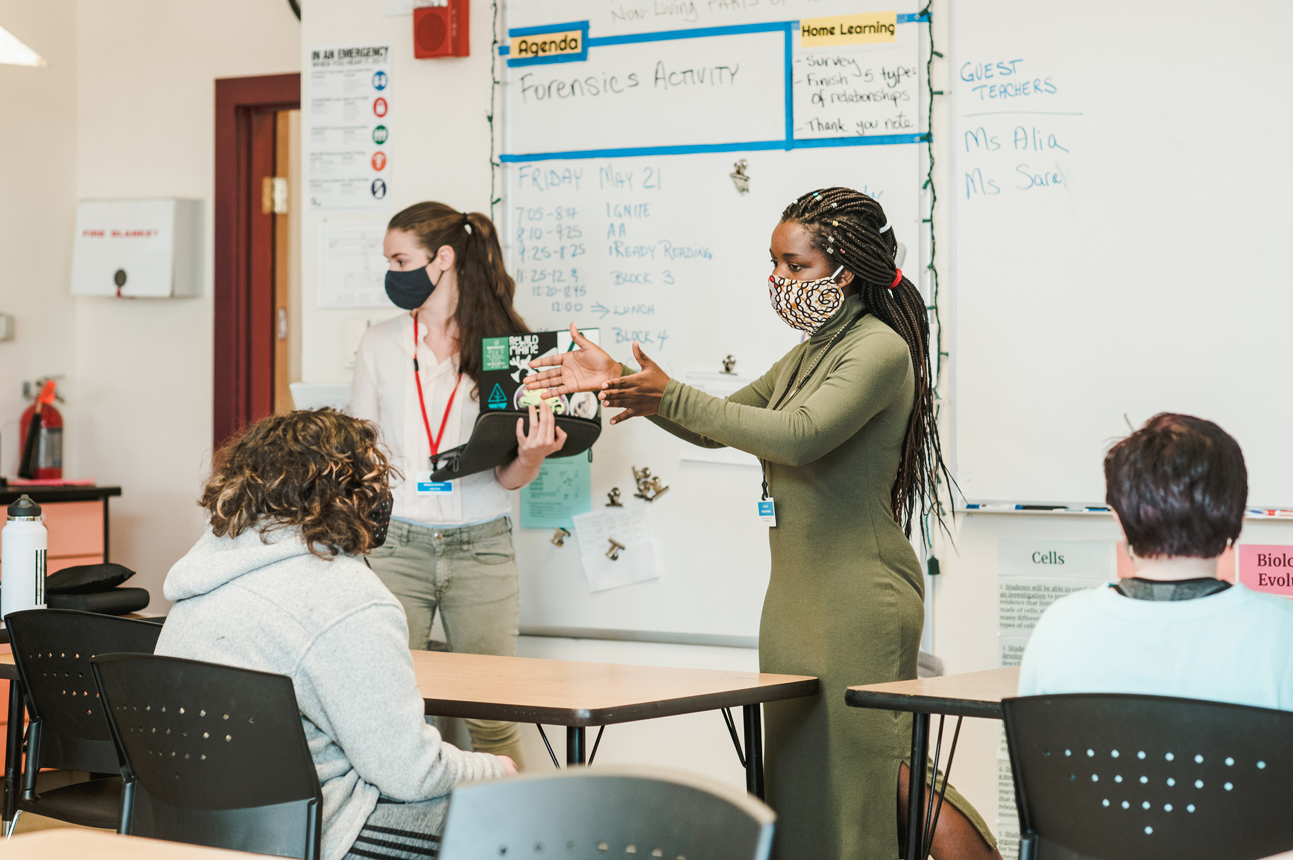 students teaching science to middle schoolers