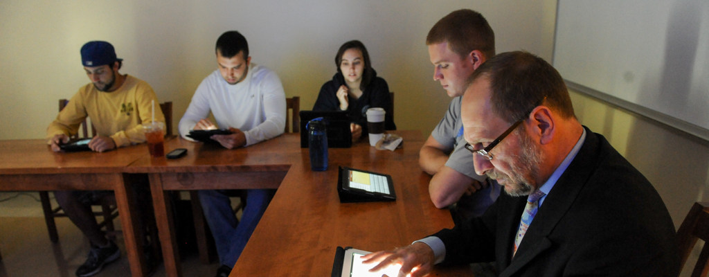 international business students work on ipads