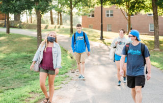 students walking across campus