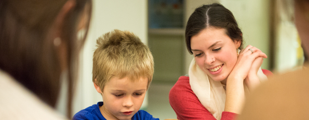 elementary education student works with a child