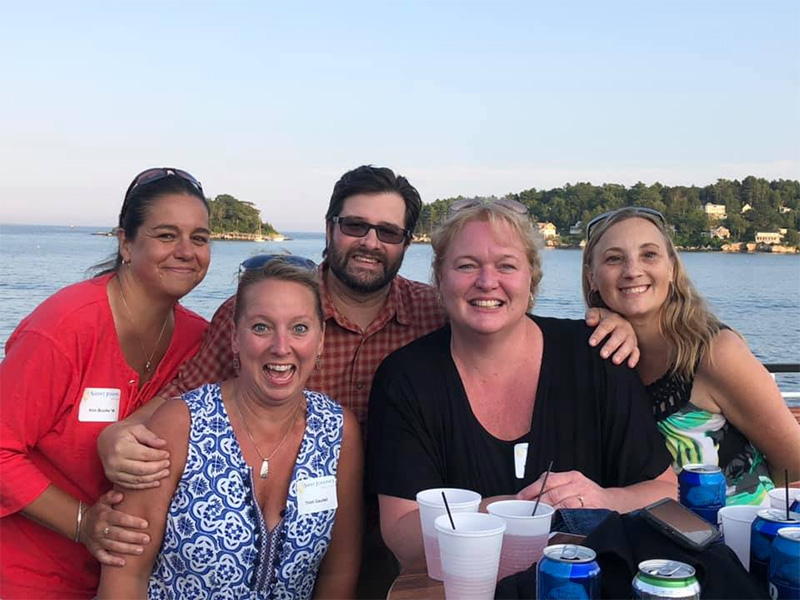 Alumni pose on the deck at the Welcome Back Cruise during 2019 Alumni Weekend