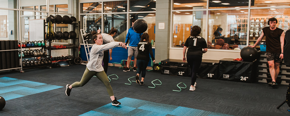 students working out in fitness room