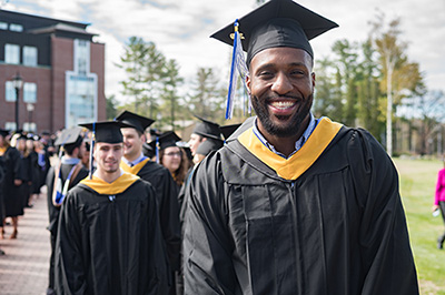 graduates marching to Commencement ceremonies at Saint Joseph's College of Maine