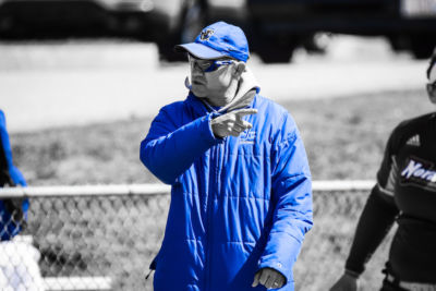 Softball Co-Head Coach Jamie Smyth instructs his team during a game