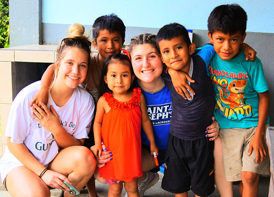 &Quot;I Can Spend A Week Of My Life And Give To The People Who Need It Most.&Quot; 7 SJC students pose with some of the local children in Guatemala.