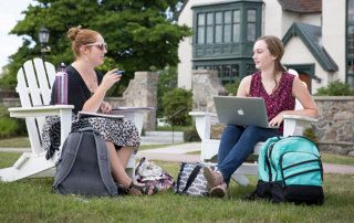 2 female students studying outside