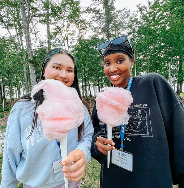 Welcome-Weekend-Block4 students eating cotton candy during new student orientation